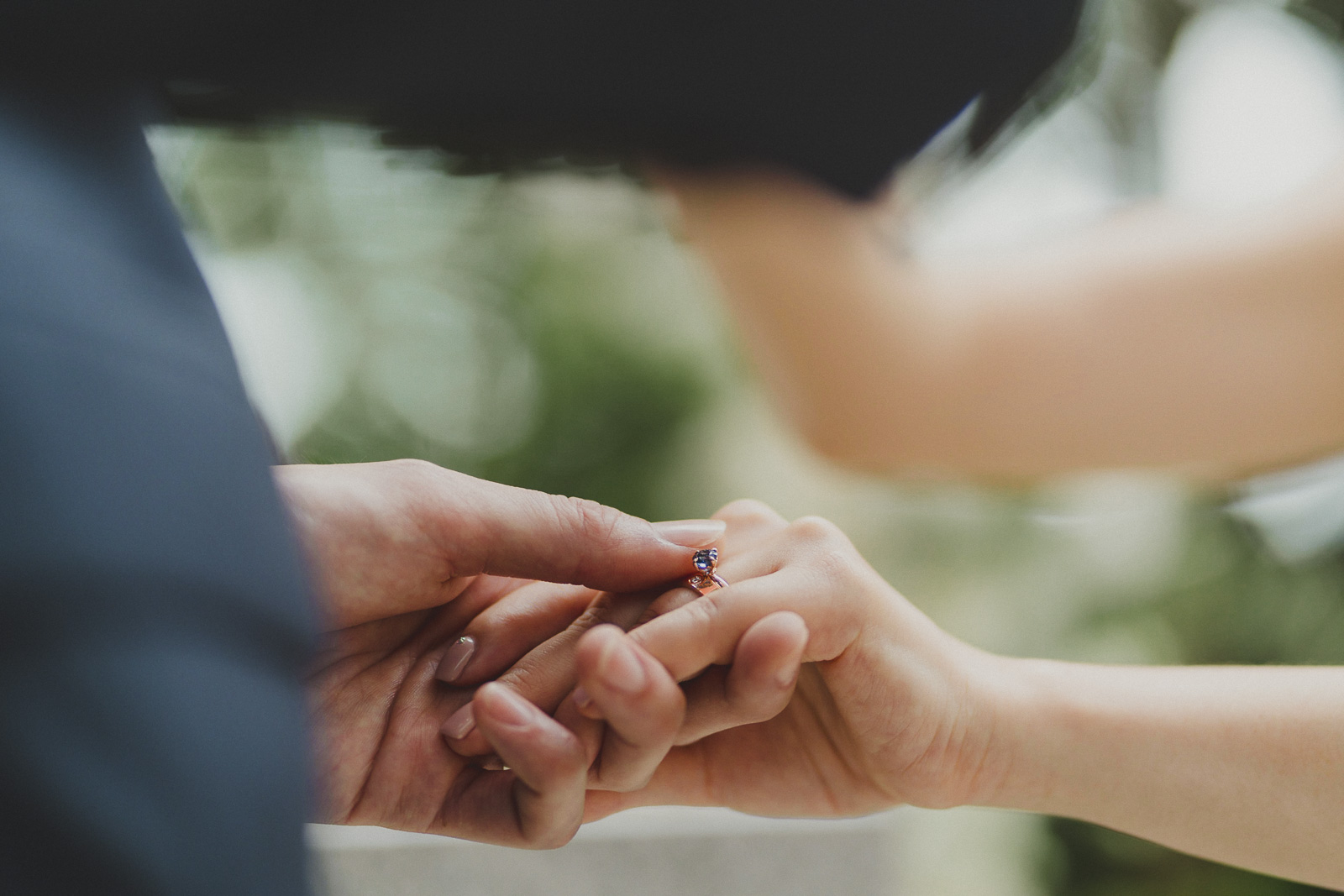 groom giving bride the ring